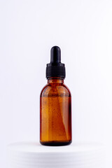 Single brown serum bottle for mock up. Sustainability and eco friendly lifestyle product concept..