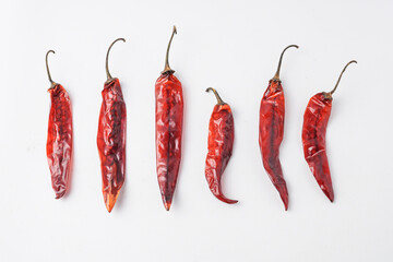 Dried large red chilies for making chili powder or seasoning for various dishes. Isolated on white background