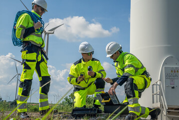 Fototapeta premium electric engineer or technician employed for inspection, maintenance, and repair of wind turbines for clean, sustainable energy and green ecological power concepts.alternative renewable wind energy 