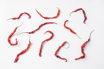 Curly red chilies that is dried for making chili powder or seasoning for various dishes. Isolated...