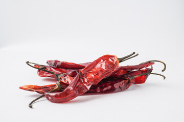 Dried large red chilies for making chili powder or seasoning for various dishes. Isolated on white background