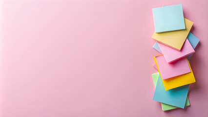 Pastel Paradise: A vibrant stack of colorful sticky notes on a soft pink background, perfect for adding a touch of playful organization to your projects.  