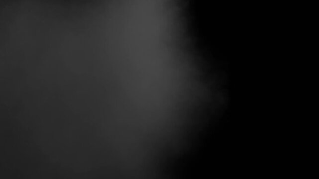 Dense smoke cloud on a dark background