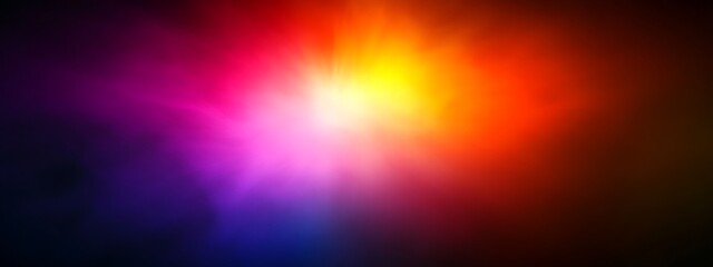 Obraz premium Abstract colorful background with blurry light effect in shades of red, orange, yellow, pink, purple, and blue.