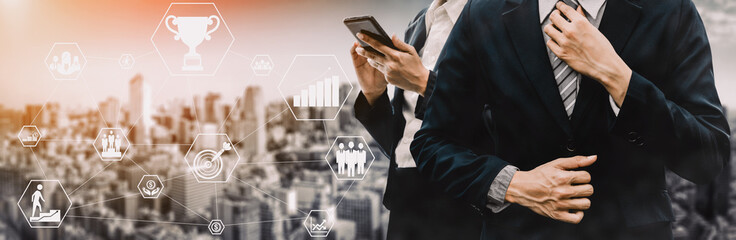 Achievement and Business Goal Success Concept - Creative business people with icon graphic interface showing employee reward giving for business success achievement. uds