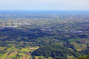 view from above of the italian plain called po valley with city houses and fields