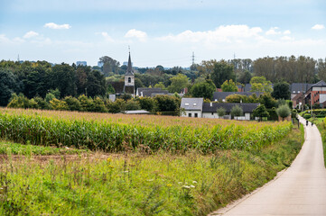 Landscape view over agriculture fields and the village of Ossel, Merchtem, Belgium
