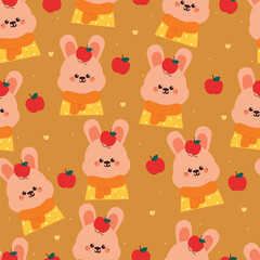 Obraz premium seamless pattern cartoon bunny with apple. cute animal with autumn vibes wallpaper for textile, gift wrap paper