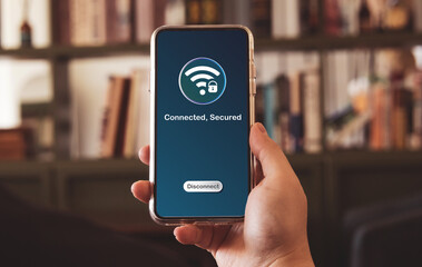 Man using smartphones connect secured to wireless fidelity (Wi-Fi) internet. Concepts of technological, wireless network connections, security cyber, and WiFi encryption.