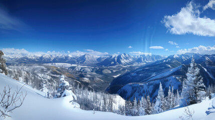 Fototapeta premium A panoramic view of a mountain range in winter, with fresh powder and deep blue skies