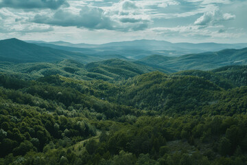 Fototapeta premium A secluded mountain landscape with sweeping vistas and dense forests, ideal for a film set