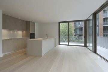 Obraz premium Contemporary kitchen and living area in a modern apartment with large windows and natural light