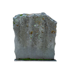 Isolated old gray jagged tombstone (no text) with moss growing on it.