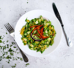 A vibrant illustration of a fresh salad in a white bowl, filled with mixed greens, bright red bell peppers, and finely chopped vegetables