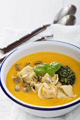 Pumpkin cream soup with cheese tortellini