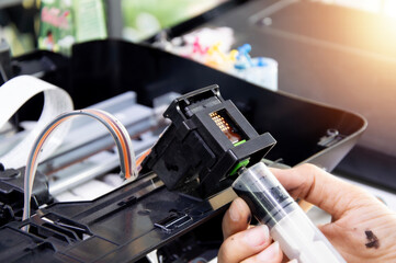 Printer repair technician, print head and ink suction technician