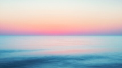 Obraz premium Soft pastel sunrise over calm ocean waters with gentle waves and soothing colors.