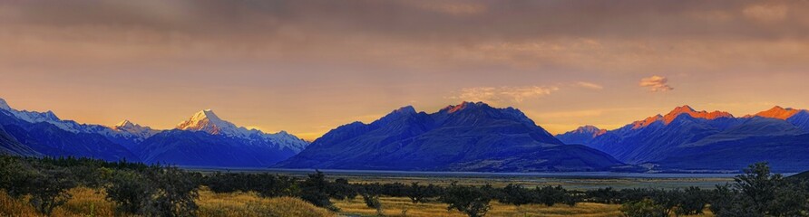 Panorama of the peak of Mount Cook, Aoraki and bush landscape at sunset, Mount Cook National Park, Southern Alps, South Island, New Zealand, Oceania