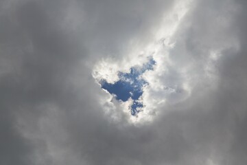 Blue hole in cloud blanket, Germany, Europe