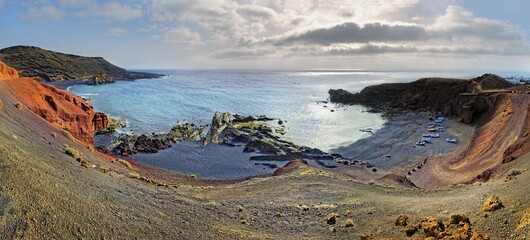 Coast of Charco de los Ciclos, Montana de Golfo, volcano crater partially submerged in sea, El...