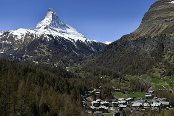 Matterhorn and residential buildings in Zermatt, Switzerland, Europe - Powered by Adobe