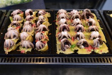 Baby octopus on grill at a food stall, Pattaya, Thailand, Asia