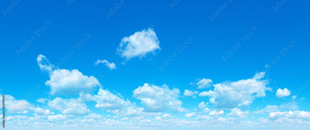 Wall mural blue sky background with tiny clouds. panorama background