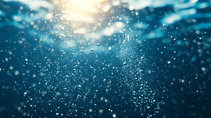 Bubbles rising to the surface in a tranquil underwater setting illuminated by sunlight
