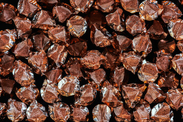 Pile of copper wire scrap in a non-ferrous metal recycling factory, a raw material for reuse