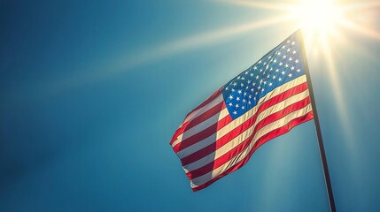 Obraz premium Waving Flag Against a Bright Sky: A Symbol of Freedom, Patriotism, and Unity Glows Under the Radiant Sunshine of a New Day