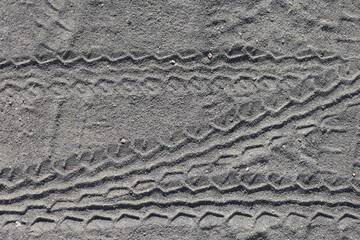  texture of sand with car tire print