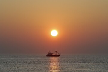 Boat, fishing boat at sunset, Texel, West Frisian Islands, North Holland province, The Netherlands,...
