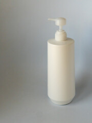 white plastic bottles without labels on a white background