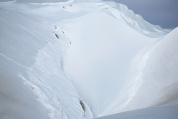 Aerial panorama view of one skier off-piste powder skiing in a beautiful vast white snow field in Norway
