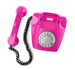 Old magenta color telephone with rotary dial isolated on white, top view