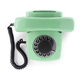 Old aquamarine telephone with rotary dial isolated on white, top view