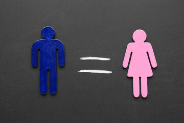 Gender equality concept. Male and female figures on chalkboard, flat lay