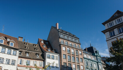The rooftops of French apartment buildings in the historical district of Strasbourg, Alsace. Charming architecture highlighting real estate properties in the area