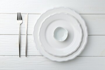 Stylish plates, cutlery and sauce bowl on white wooden table, top view