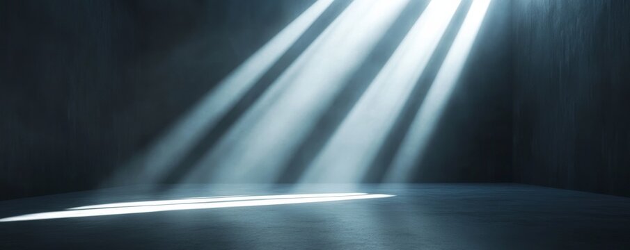 Dimly lit empty room with light rays through window, minimalist concept