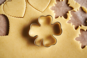 Preparation of Linzer Christmas cookies - cutting out shapes from pastry dough