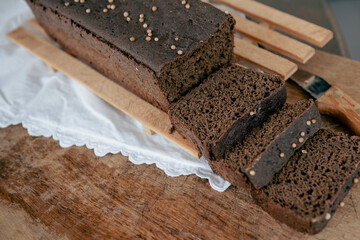 Sliced rye homemade bread. rye sourdough bread on a wooden cutting board.