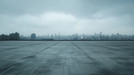 Obraz premium Minimalist Modern Background Featuring an Empty Concrete Floor with a Distant City Skyline and Overcast Sky, Perfect for Presentations and Promotional Material in an Urban Sophisticated Style.