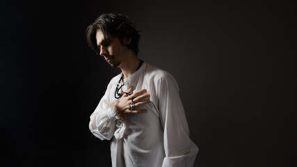 The dramatic hero calls out to the gods in the pose of a praying man, the style of classical...