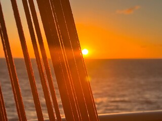 Ropes on ship at sunset