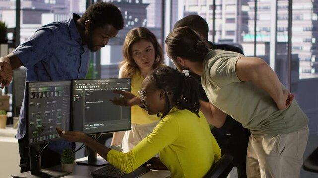 IT staff members arguing, having different ideas while testing and deploying programs and systems. Team of programmers fighting in office while checking code, having disagreement, camera A