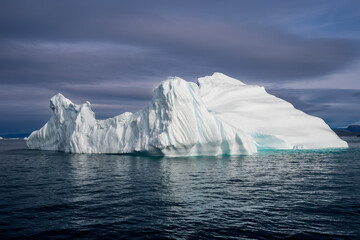 Solitary iceberg floating in Disko bay off the coast of western Greenland