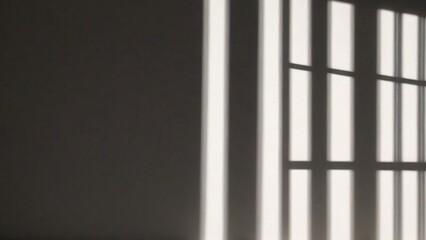 Fototapeta premium Abstract shadow of window panes on a white wall.