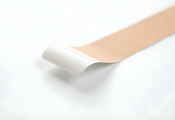 Obraz premium a section of glossy adhesive tape, placed on a white background, with a slight twist to show its flexibility and shine create with ai