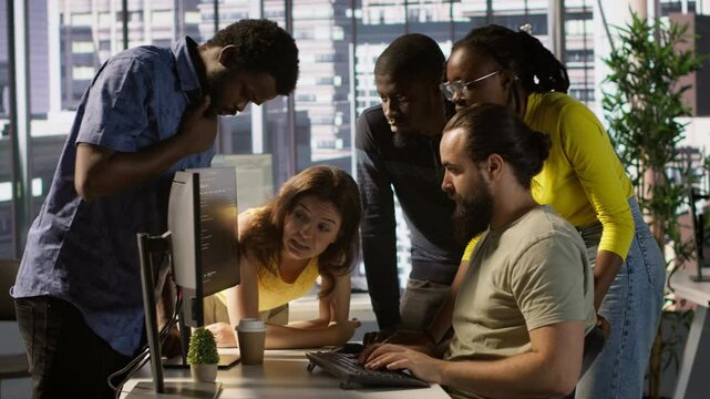 Programmers gathered together to conduct code review to fix errors, identifying technical issues with company software. Team of developers doing brainstorming, optimizing code, camera A